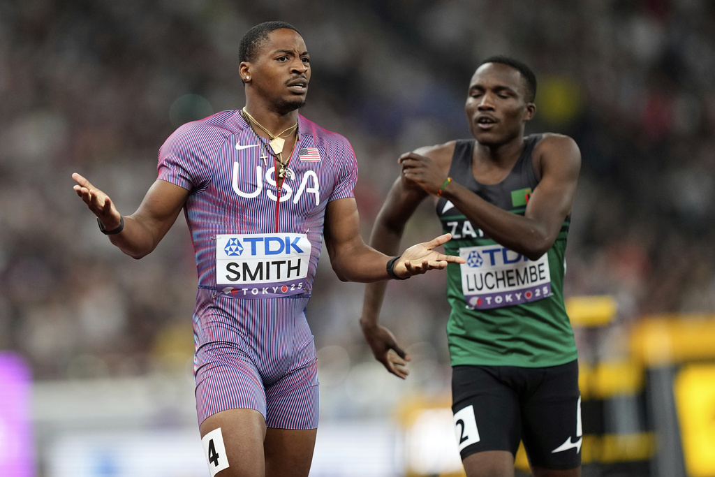 United States' Demarius Smith reacts after a poor baton change to United States' Bryce Deadmon in a men's 4 X 400 meters relay heat at the World Athletics Championships in Tokyo, Saturday, Sept. 20, 2025. (AP Photo/Petr David Josek)