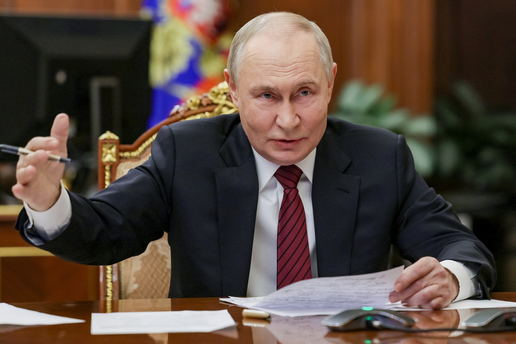 Russian President Vladimir Putin gestures during a call with military leaders on the Ukraine battlefield situation at the Kremlin in Moscow, on Thursday, Dec. 11, 2025. (Gavriil Grigorov, Sputnik, Kremlin Pool Photo via AP)