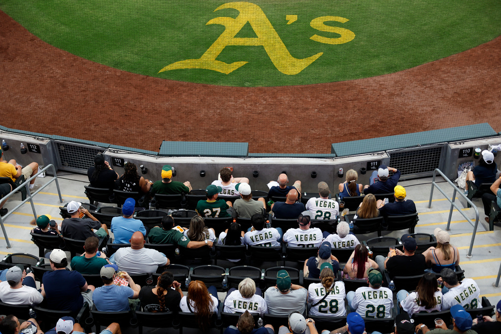 Fans gather to watch the Milwaukee Brewers face off against the Athletics during the first inning of a baseball game Monday, June 8, 2026, in Las Vegas. (AP Photo/Caroline Brehman)