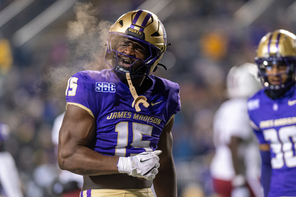James Madison defensive lineman Sahir West (15) celebrates after play during the first half of the Sun Belt Championship NCAA college football game, Friday, Dec. 5, 2025, in Harrisonburg, Va. (AP Photo/Robert Simmons)