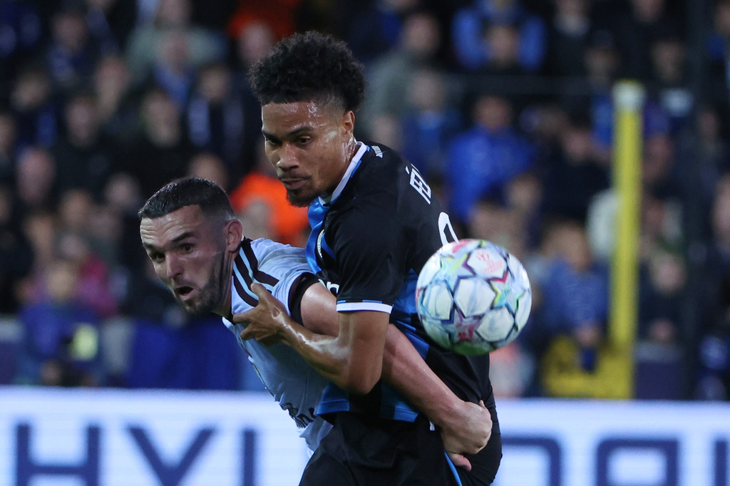 Aston Villa's John McGinn battles for the ball with Brugge's Felix Lemarechal during the Champions League opening phase soccer match between Club Brugge and Aston Villa in Bruges, Belgium, Tuesday, Sept. 8, 2026. (AP Photo/Omar Havana)