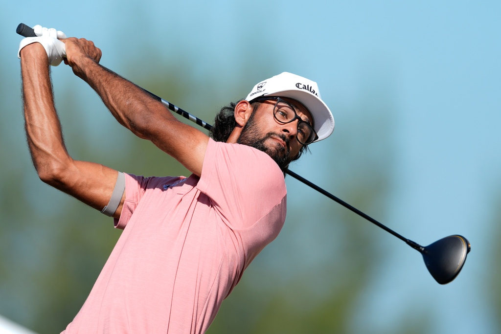 Akshay Bhatia, of the United States, watches his tee shot on the fourth tee during the second round of the Hero World Challenge PGA Tour at the Albany Golf Club, in New Providence, Bahamas, Friday, Dec. 5, 2025. (AP Photo/Fernando Llano)