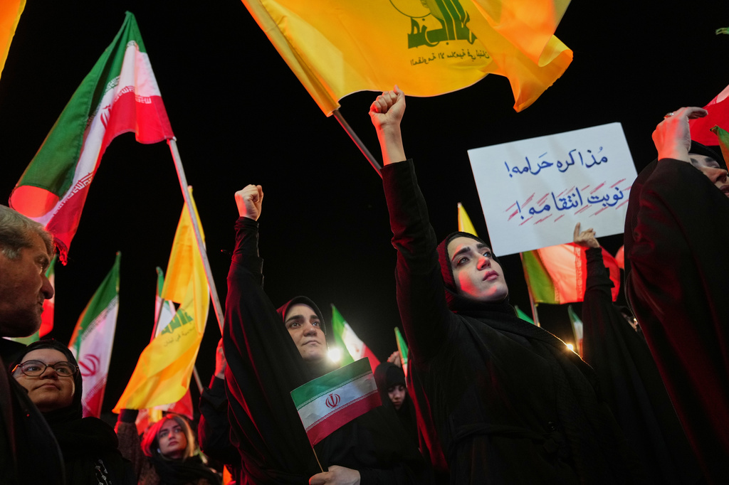 Government supporters gather ahead of the funeral procession for Maj. Gen. Majid Khademi, head of intelligence for Iran's paramilitary Revolutionary Guard, in Tehran, Iran, Wednesday, April 8, 2026. (AP Photo/Francisco Seco)