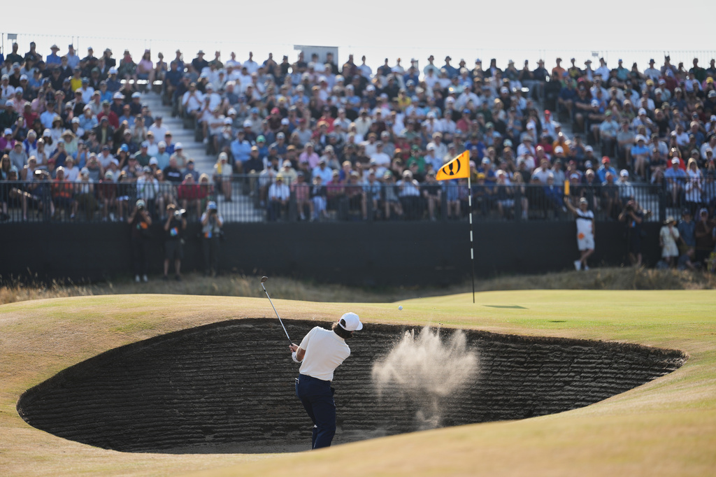 Tommy Fleetwood of England plays out of a bunker on the 14th green during the third day of the British Open Golf championships at Royal Birkdale golf club, in Southport, England, Saturday, July 18, 2026. (AP Photo/Jon Super)