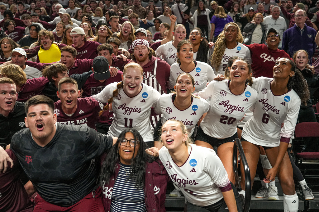 Texas A&M players and fans celebrate winning the NCAA Division I volleyball playoff game against TCU, Saturday, Dec. 6, 2025, in College Station, Texas. (Aaron E. Martinez/Austin American-Statesman via AP)
