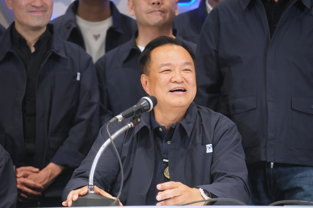 Thailand's Prime Minister and leader of Bhumjaithai Party Anutin Charnvirakul, center, speaks during a press conference at the party headquarters following the general election in Bangkok, Sunday, Feb. 8, 2026. (AP Photo/Sakchai Lalit)
