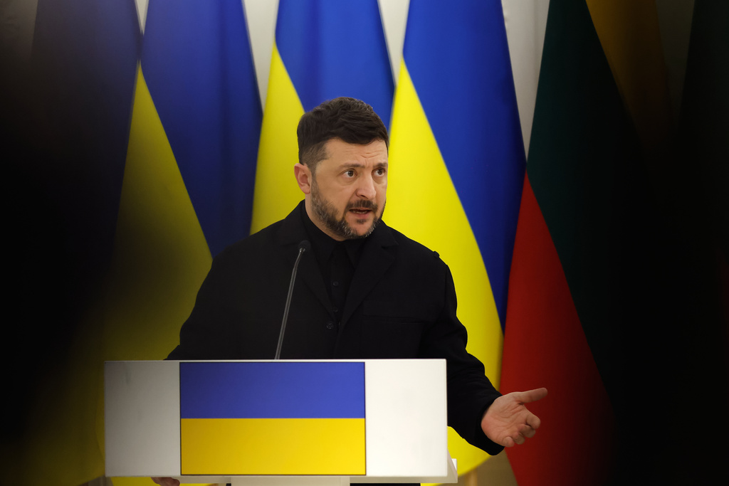 Ukrainian President Volodymyr Zelenskyy gestures while speaking at a joint press conference with Lithuania's President Gitanas Nauseda and Polish President Karol Nawrocki, at the Presidential palace in Vilnius, Lithuania, Sunday, Jan. 25, 2026. (AP Photo/Mindaugas Kulbis)
