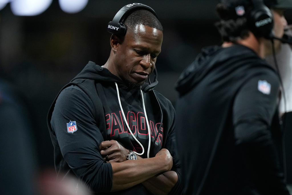 Atlanta Falcons head coach Raheem Morris looks down on the sideline as his team trails against the Seattle Seahawks during the second half of an NFL football game, Sunday, Dec. 7, 2025, in Atlanta. (AP Photo/Brynn Anderson)
