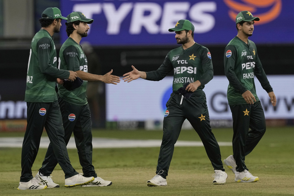 Pakistan players greet each other after their loss in the Asia Cup cricket match against India at Dubai International Cricket Stadium in Dubai, United Arab Emirates, Sunday, Sept. 14, 2025. (AP Photo/Fatima Shbair)