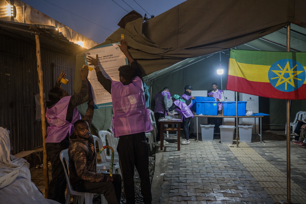 Election officials prepare a polling station before voting begins in the general election in Addis Ababa, Ethiopia, Monday, June 1, 2026. (AP Photo/Amanuel Sileshi)