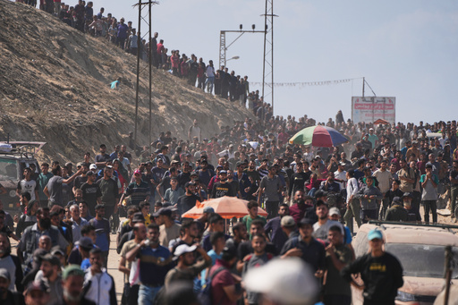 Displaced Palestinians walk along the coastal road near Wadi Gaza in the central Gaza Strip, moving toward northern Gaza, Friday, Oct. 10, 2025, after Israel and Hamas have agreed to a pause in their war and the release of the remaining hostages. (AP Photo/Abdel Kareem Hana) Displaced Palestinians walk along the coastal road near Wadi Gaza in the central Gaza Strip, moving toward northern Gaza, Friday, Oct. 10, 2025, after Israel and Hamas have agreed to a pause in their war and the release of the remaining hostages. (AP Photo/Abdel Kareem Hana)