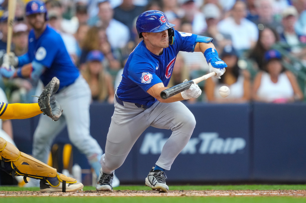 Chicago Cubs' Matt Shaw hits a sacrifice bunt during the sixth inning of a baseball game against Milwaukee Brewers Monday, Sept. 7, 2026, in Milwaukee. (AP Photo/Kayla Wolf)