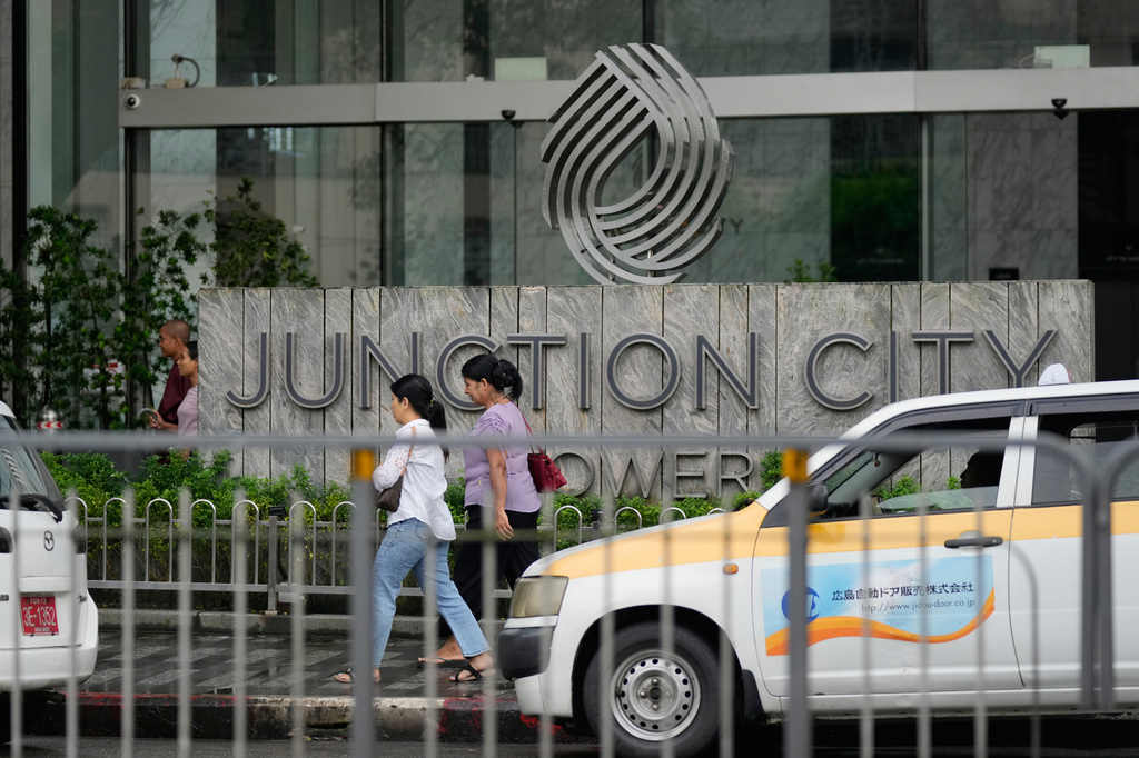 FILE - Pedestrians walk past entrance of Junction City Tower, where the American Chamber of Commerce in Myanmar has its office, on Tuesday, Sept. 15, 2026, in Yangon, Myanmar. (AP Photo, File)