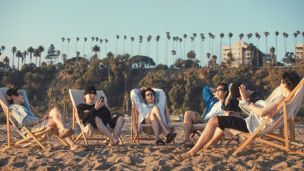 This image released by Netflix shows BTS members, from left, j-hope, Suga, Jin, RM, Jung Kook, and Jimin in a scene from the documentary "BTS: The Return." (Netflix via AP)