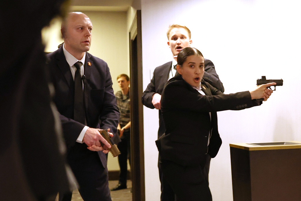 Secret service agents respond during the White House Correspondents Dinner, Saturday, April 25, 2026, in Washington. (AP Photo/Tom Brenner)