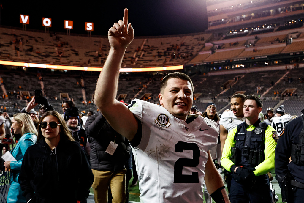 Vanderbilt quarterback Diego Pavia (2) celebrates after an NCAA college football game Saturday, Nov. 29, 2025, in Knoxville, Tenn. (AP Photo/Wade Payne)