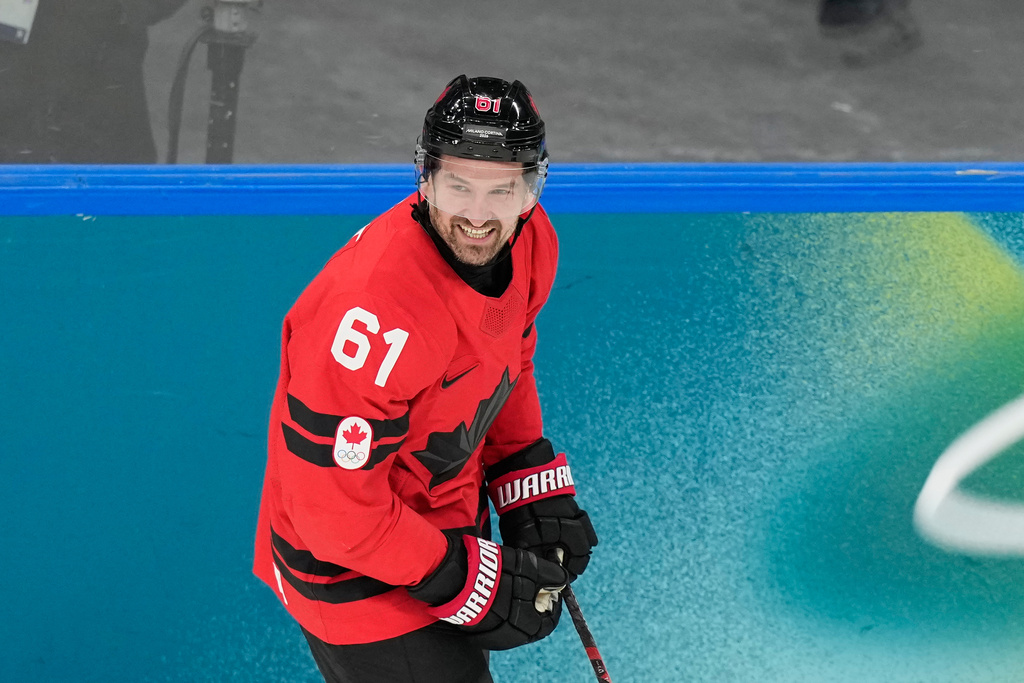 Canada's Mark Stone (61) celebrates after scoring a goal during a preliminary round game of men's ice hockey between Canada and France at the 2026 Winter Olympics, in Milan, Italy, Sunday, Feb. 15, 2026. (AP Photo/Hassan Ammar)