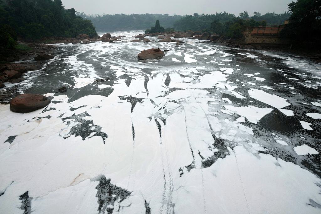 FILE- Foam created mostly by untreated household sewage from nearby Sao Paulo, covers the surface of the Tiete River in Salto, Brazil, May 15, 2026. (AP Photo/Andre Penner, File)