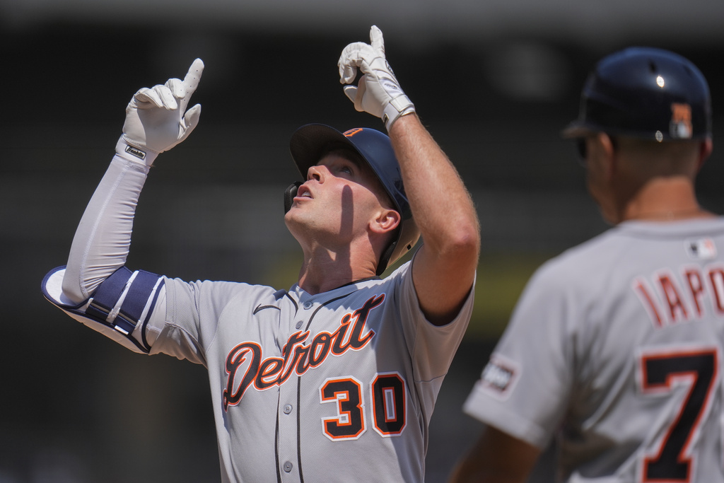 Detroit Tigers' Kerry Carpenter (30) points up after hitting a single during the sixth inning of a baseball game against the Chicago White Sox, Wednesday, Aug. 13, 2025, in Chicago. (AP Photo/Erin Hooley)