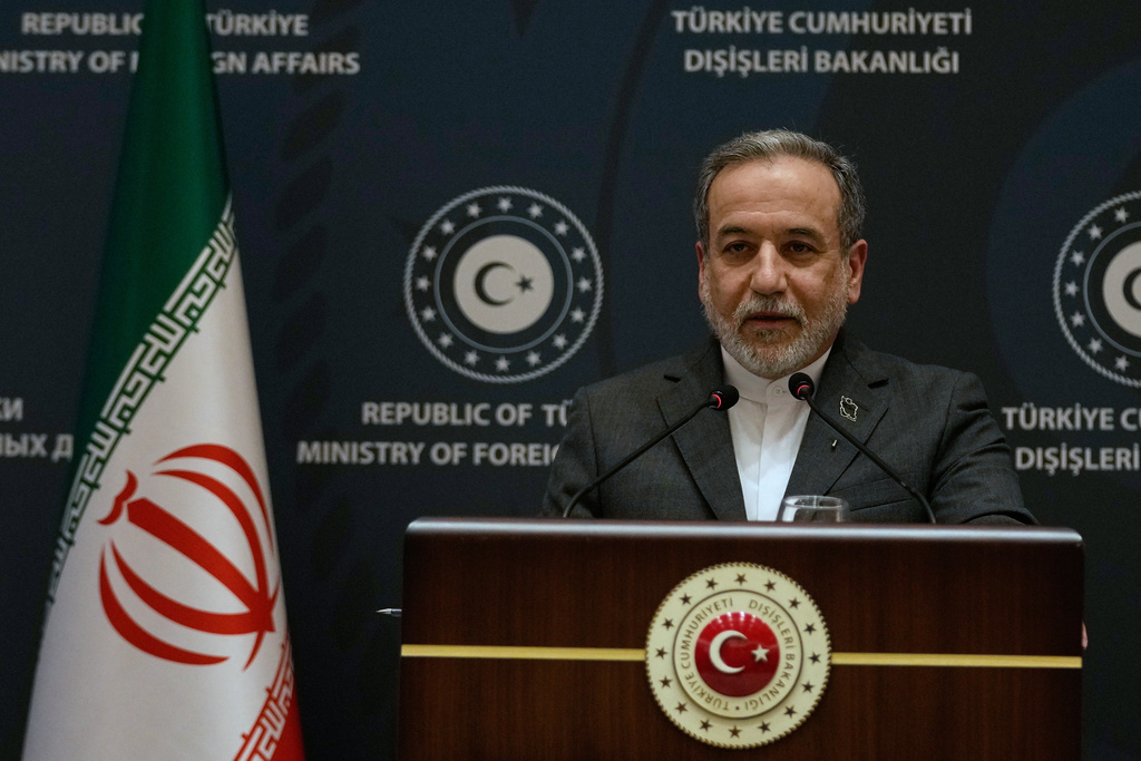 Iranian Foreign Minister Abbas Araghchi speaks to journalists during a joint press conference with his Turkish counterpart Hakan Fidan in Istanbul, Turkey, Friday, Jan. 30, 2026. (AP Photo/Khalil Hamra)