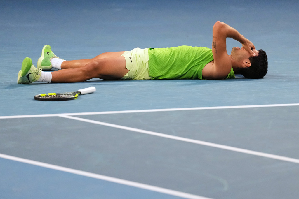 Carlos Alcaraz of Spain celebrates after defeating Alexander Zverev of Germany in their semifinal match at the Australian Open tennis championship in Melbourne, Australia, Friday, Jan. 30, 2026. (AP Photo/Dita Alangakra)