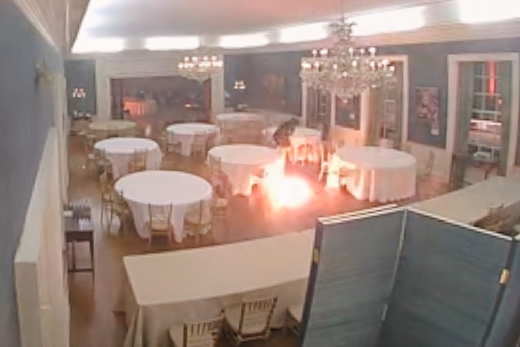 This image made from a surveillance video provided by the Dauphin County District Attorney's Office shows Cody Balmer throwing a Molotov cocktail in governor's mansion on April 13, 2025, in Harrisburg, Pa. (Dauphin County District Attorney's Office via AP)