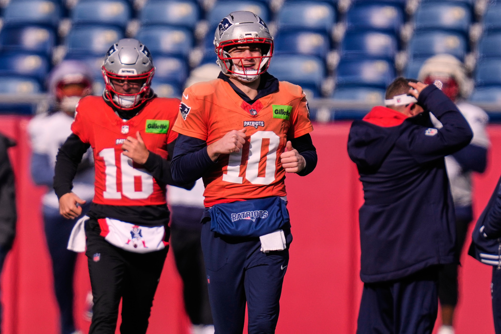 New England Patriots quarterback Drake Maye (10) runs with teammates during a football availability, Friday, Jan. 23, 2026, in Foxborough, Mass. (AP Photo/Charles Krupa)