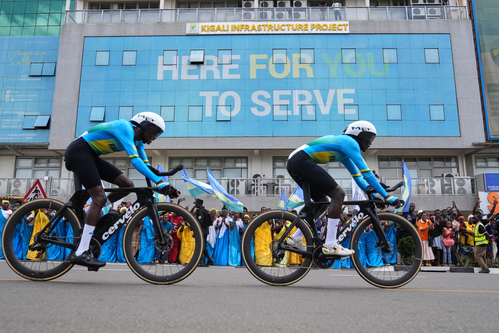 Team Rwanda competes, during the team time trial mixed relay event, at the road cycling World Championships in Kigali, Rwanda, Wednesday, Sept. 24, 2025. (AP Photo/Jerome Delay)