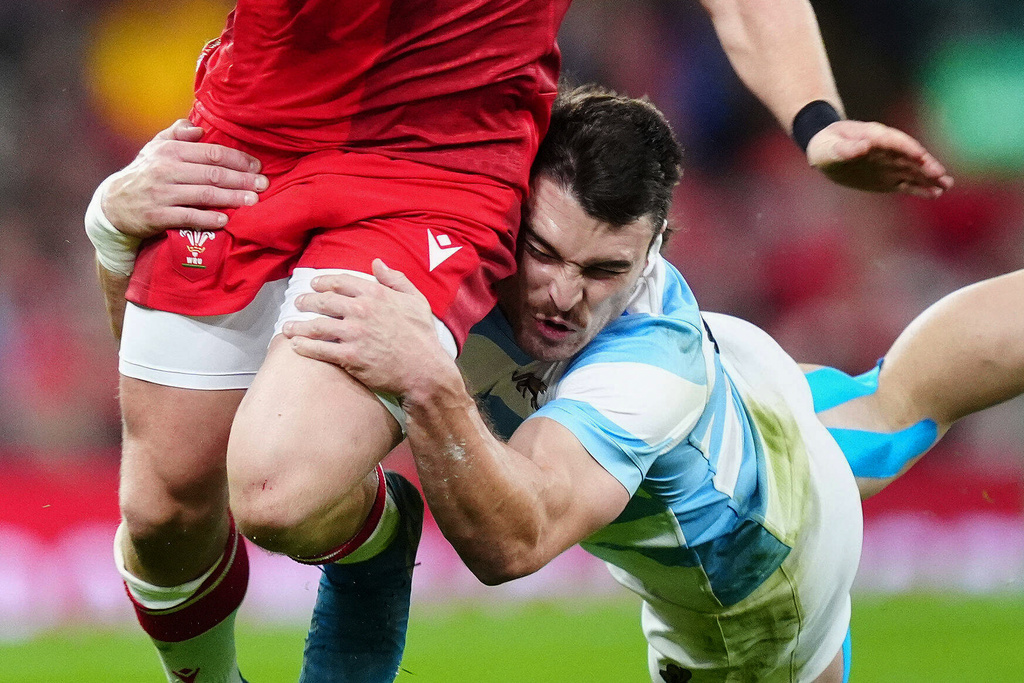 Wales' Blair Murray, left, is tackled by Argentina's Mateo Carreras, right, during the Quilter Nations Series rugby match between Wales and Argentina in Cardiff, Wales, Sunday, Nov. 9, 2025. (David Davies/PA via AP)