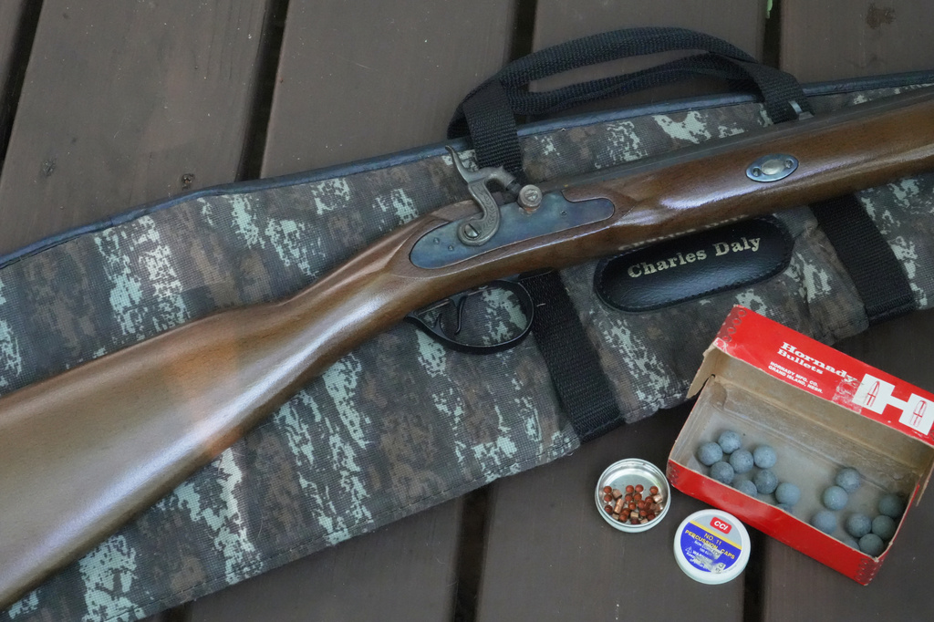 A .50-caliber Hawken replica rifle with lead balls and percussion caps sits on a deck in Wake Forest, N.C., on Monday, May 4, 2026. (AP Photo/Allen G. Breed)