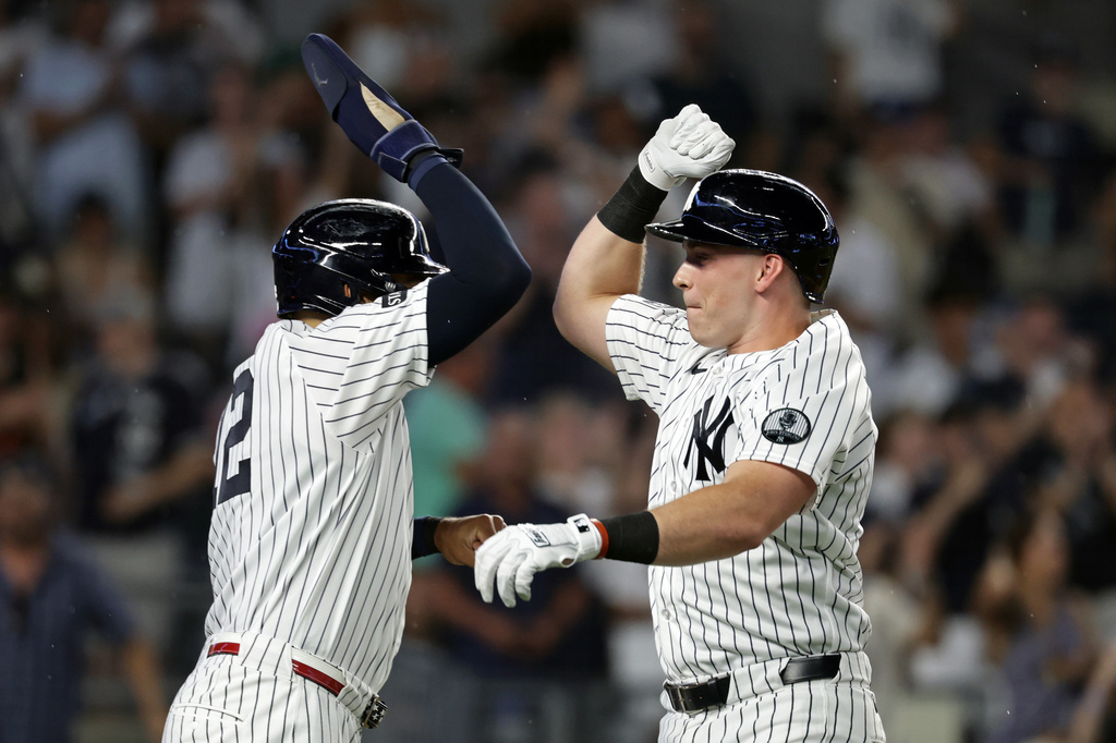 New York Yankees' Ben Rice, right, celebrates hitting a two-run home run with Trent Grisham, left, during the third inning of a baseball game against the Minnesota Twins, Friday, July 3, 2026, in New York. (AP Photo/Adam Hunger)