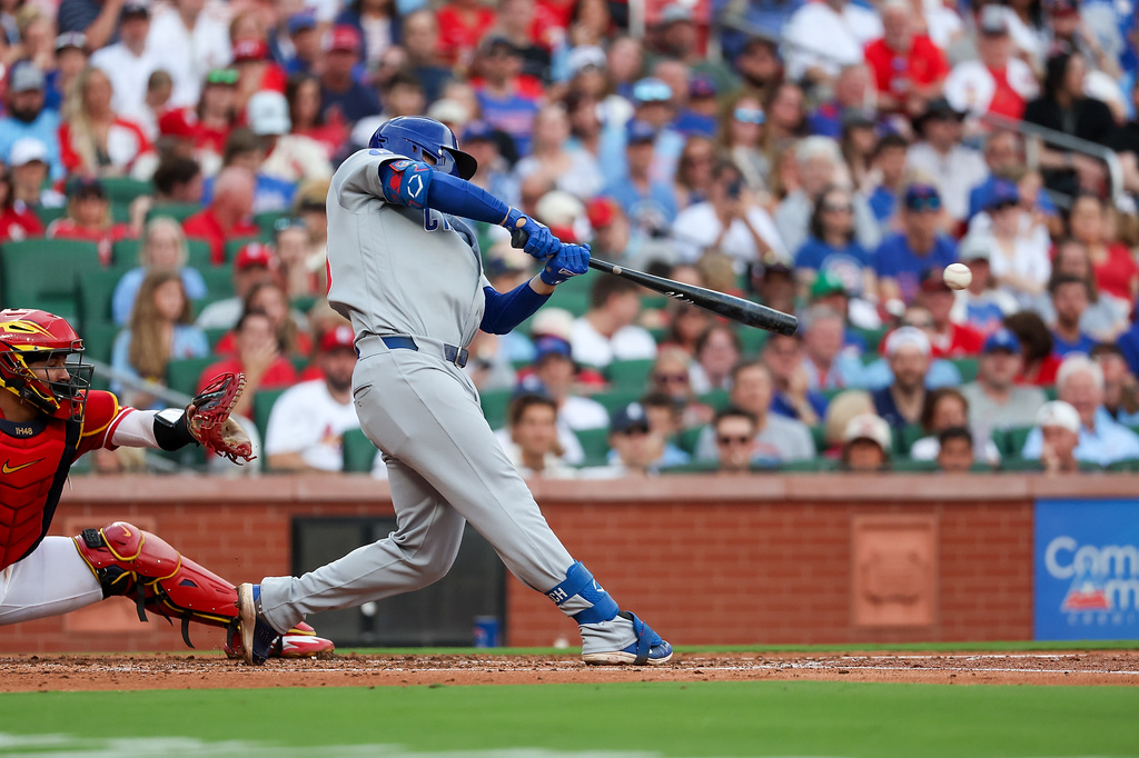 Chicago Cubs' Michael Busch an RBI single during the second inning of a baseball game against the St. Louis Cardinals Friday, May 29, 2026, in St. Louis. (AP Photo/Scott Kane)