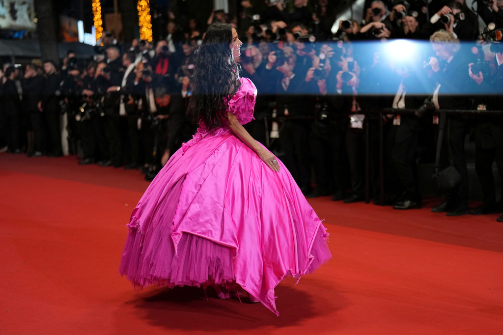 Jury member Demi Moore poses for photographers upon arrival at the premiere of the film 'Paper Tiger' at the 79th international film festival, Cannes, southern France, Saturday, May 16, 2026. (AP Photo/Andreea Alexandru)