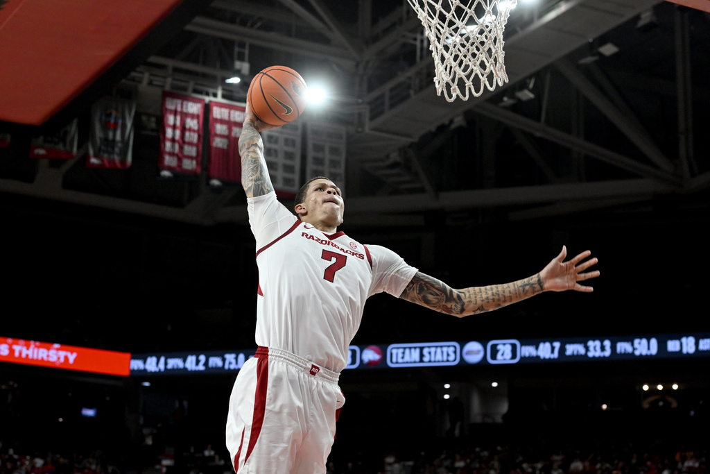Arkansas forward Trevon Brazile goes up to dunk the ball on a fast break against James Madison during an NCAA college basketball game Monday, Dec. 29, 2025, in Fayetteville, Ark. (AP Photo/Michael Woods)