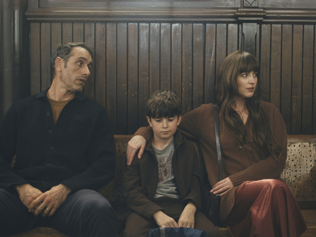 This image released by Neon shows, from left, Michael Angelo Covino, Simon Webster, and Dakota Johnsonin a scene from "Splitsville." (Neon via AP)