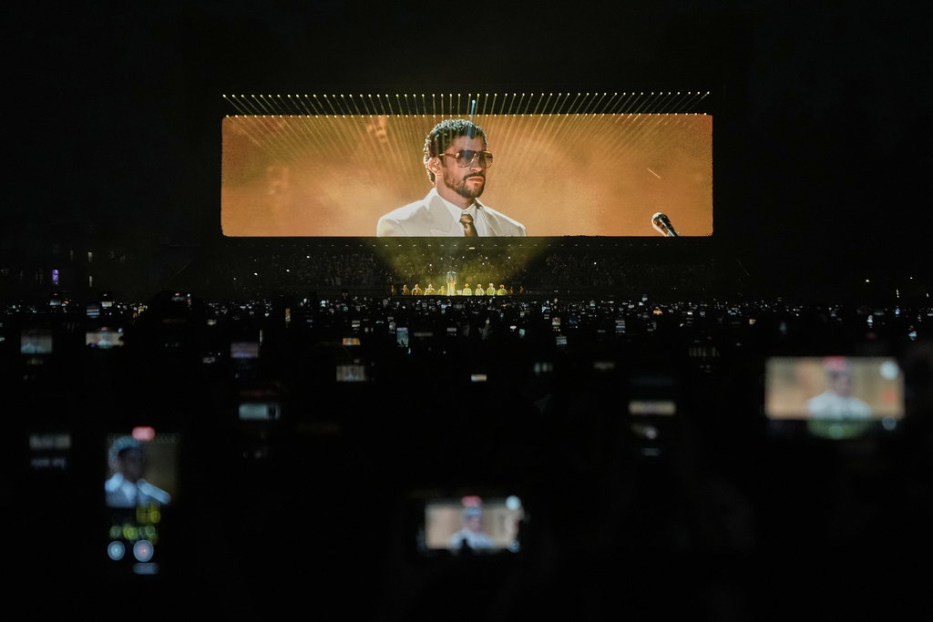 FILE - Puerto Rican rapper Bad Bunny performs during his "DeBÍ TiRAR MáS FOToS" tour in Mexico City, Dec. 10, 2025. (AP Photo/Eduardo Verdugo, File)