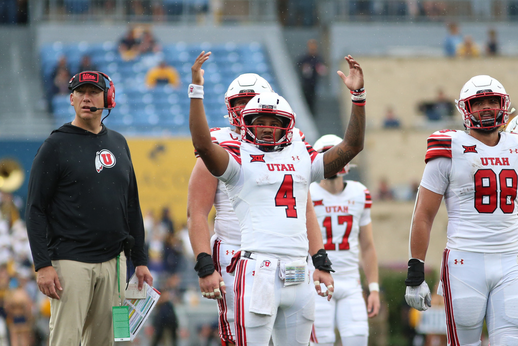 Utah players react during the second half of an NCAA college football game against West Virginia, Saturday, Sept, 27, 2025, in Morgantown, W.Va. (AP Photo/ William Wotring)