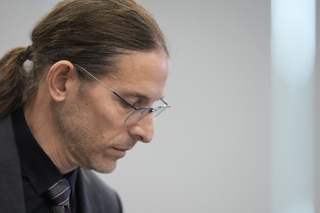 Committee member Dr. Retsef Levi listens during a meeting of the Advisory Committee on Immunization Practices at the CDC on Thursday, Sept. 18, 2025, in Chamblee, Ga. (AP Photo/Brynn Anderson)