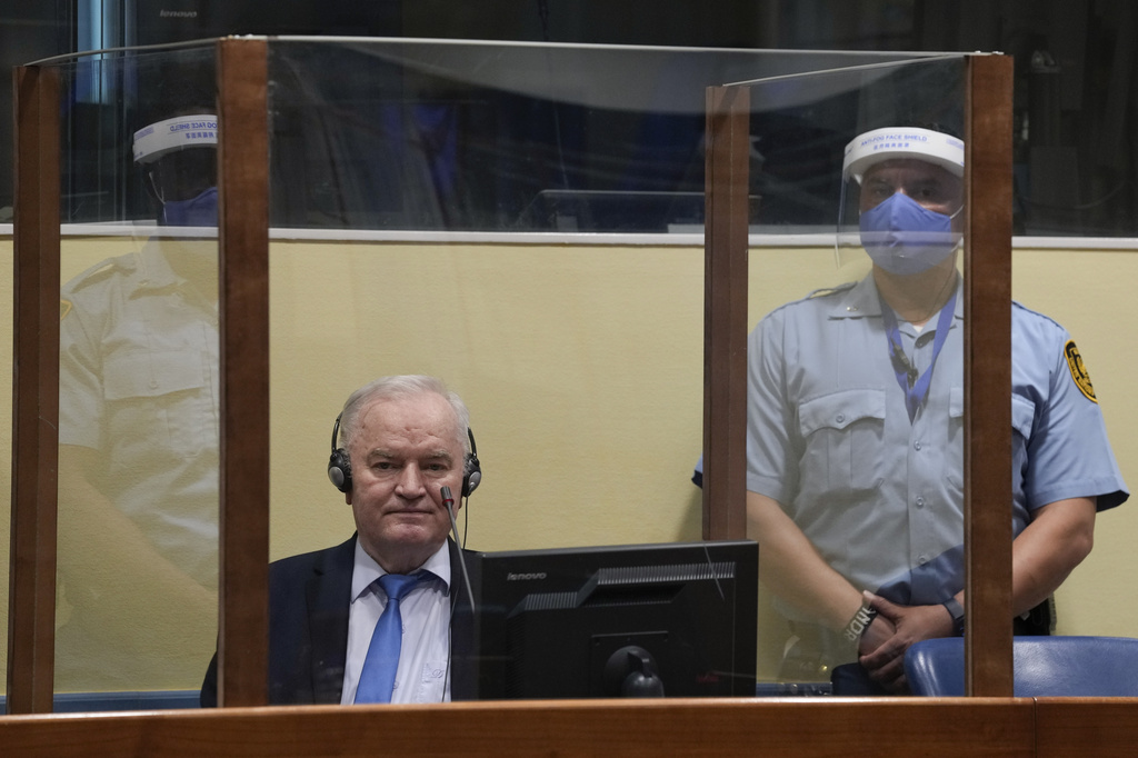 FILE - Former Bosnian Serb military chief Ratko Mladic sits in the court room in The Hague, Netherlands, Tuesday, June 8, 2021, where the United Nations court delivers its verdict in the appeal of Mladic against his convictions for genocide and other crimes and his life sentence for masterminding atrocities throughout the Bosnian war. (AP Photo/Peter Dejong, Pool, File)