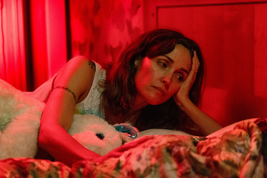 This image released by A24 shows Rose Byrne in a scene from " If I Had Legs I'd Kick You." (Logan White/A24 via AP)