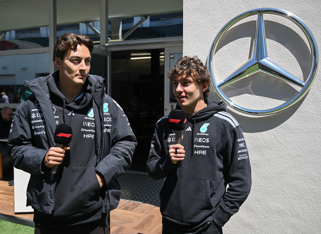 Mercedes drivers George Russell of Britain, left, and Kimi Antonelli of Italy speak during an interview in the paddocks at the F1 Canadian Grand Prix auto race in Montreal, Thursday, May 21, 2026. (Graham Hughes/The Canadian Press via AP)
