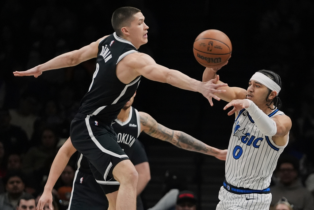 Brooklyn Nets' Egor Demin (8) defends Orlando Magic's Anthony Black (0) during the first half of an NBA basketball game Wednesday, Jan. 7, 2026, in New York. (AP Photo/Frank Franklin II)