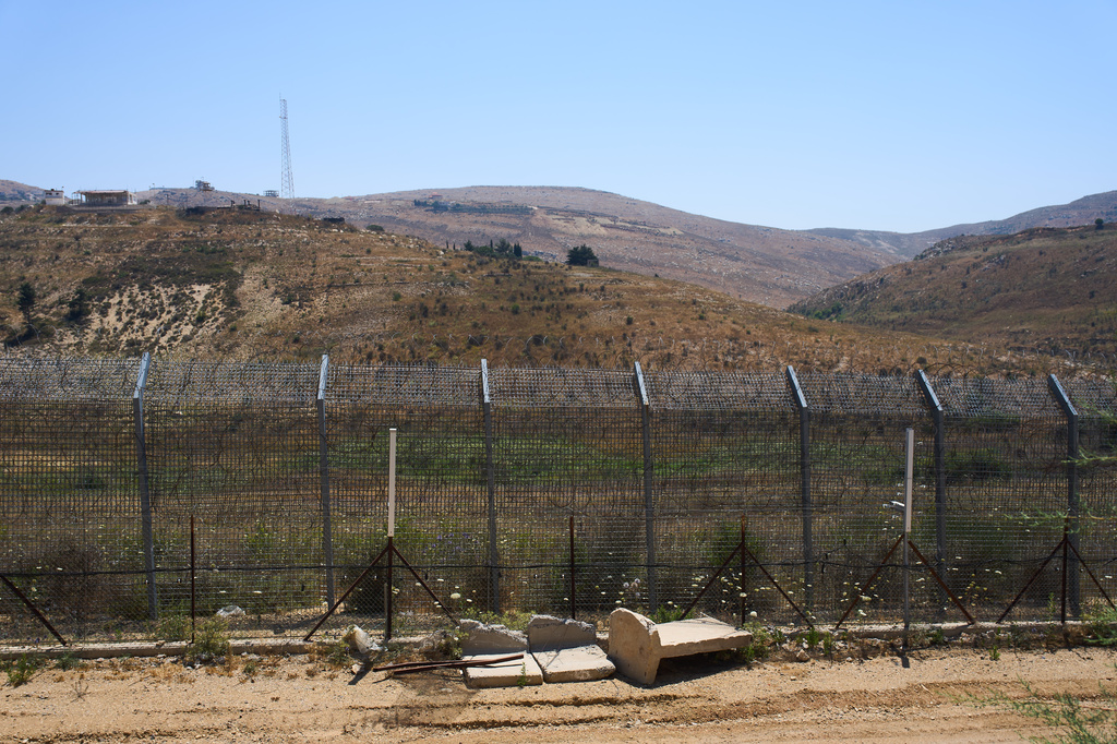 The border between Syria and the Israeli-controlled Golan Heights town of Majdal Shams is seen Tuesday, July 21, 2026. (AP Photo/Ariel Schalit)