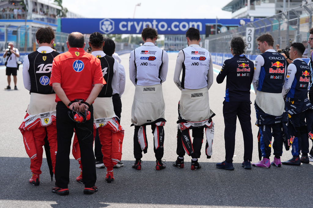 Drivers observe a minute of silence to honor Alex Zanardi before a sprint auto race at the Miami Formula One Grand Prix, Saturday, May 2, 2026, in Miami Gardens, Fla. (AP Photo/Rebecca Blackwell)