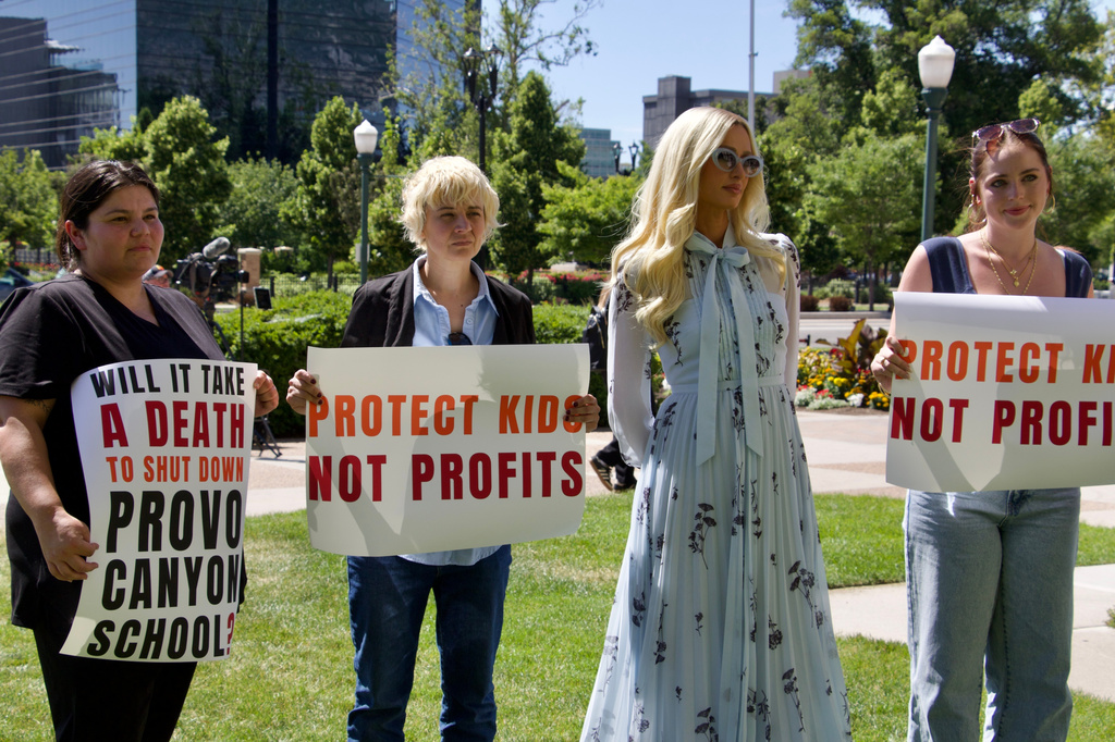 Paris Hilton appears alongside fellow survivors of residential teen treatment facilities, Monday, June 15, 2026, in Provo, Utah. (AP Photo/Hannah Schoenbaum)