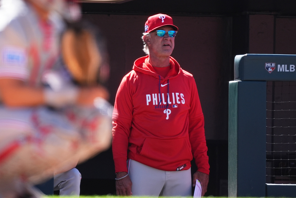 FILE - Philadelphia Phillies bench coach Don Mattingly (8) watches from the dugout steps during the sixth inning of a baseball game against the Colorado Rockies, April 5, 2026, in Denver. (AP Photo/David Zalubowski, File)