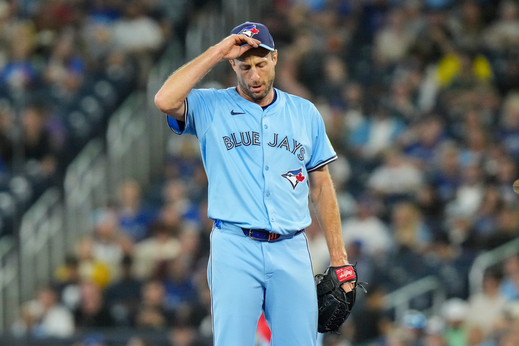Toronto Blue Jays pitcher Max Scherzer (31) reacts as he works against the Boston Red Sox during first inning MLB baseball action in Toronto on Wednesday, Sept. 24, 2025. (Chris Young/The Canadian Press via AP)