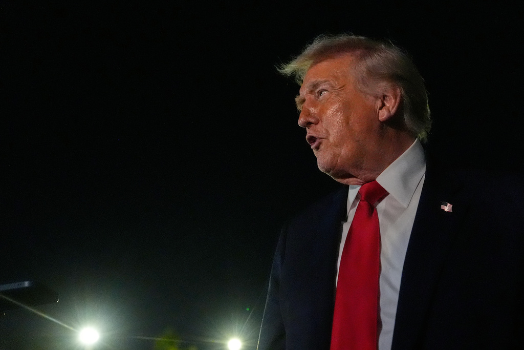 President Donald Trump speaks to reporters before boarding Air Force One at Palm Beach International Airport, Monday, Jan. 19, 2026, in West Palm Beach, Fla. (AP Photo/Julia Demaree Nikhinson)