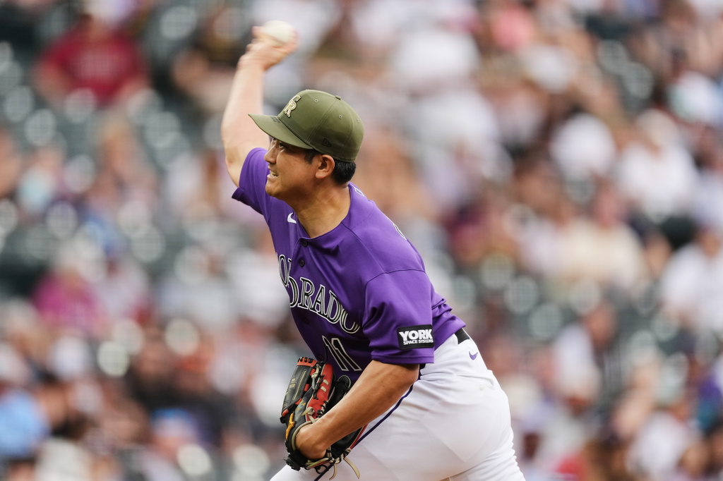 Colorado Rockies starting pitcher Tomoyuki Sugano works against the Arizona Diamondbacks in the first inning of a baseball game, Saturday, May 16, 2026, in Denver. (AP Photo/David Zalubowski)