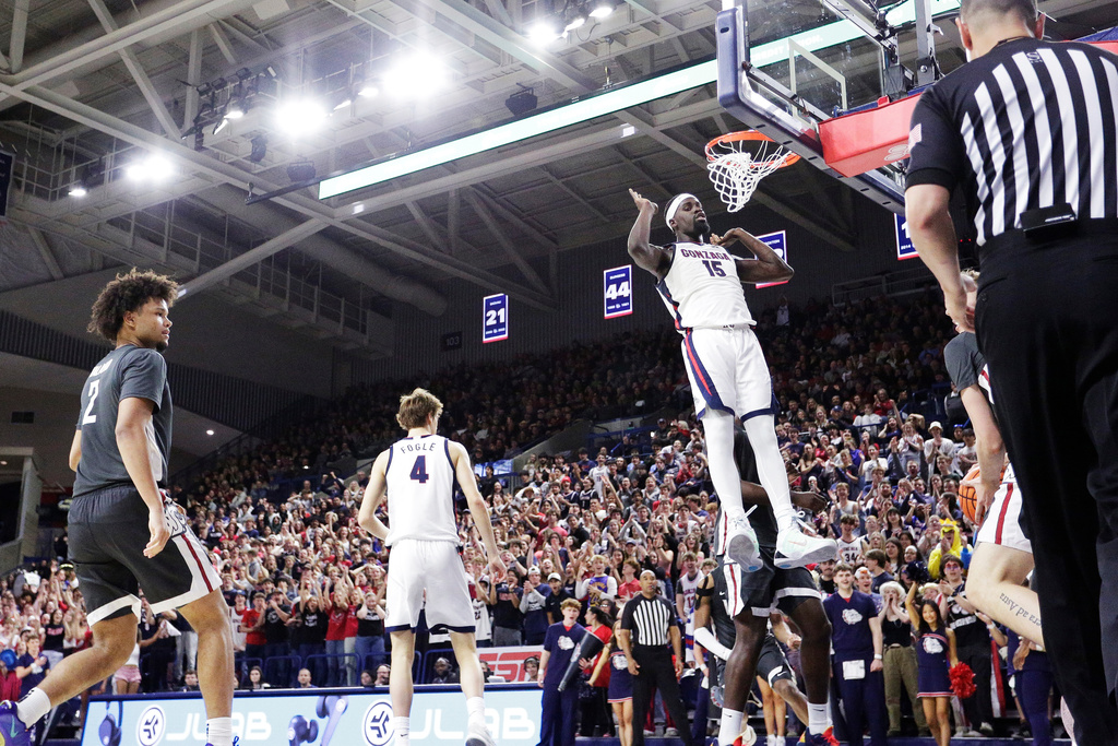 Gonzaga forward Graham Ike (15) comes down after a dunk during the second half of an NCAA college basketball game against Washington State, Tuesday, Feb. 10, 2026, in Spokane, Wash. (AP Photo/Young Kwak)